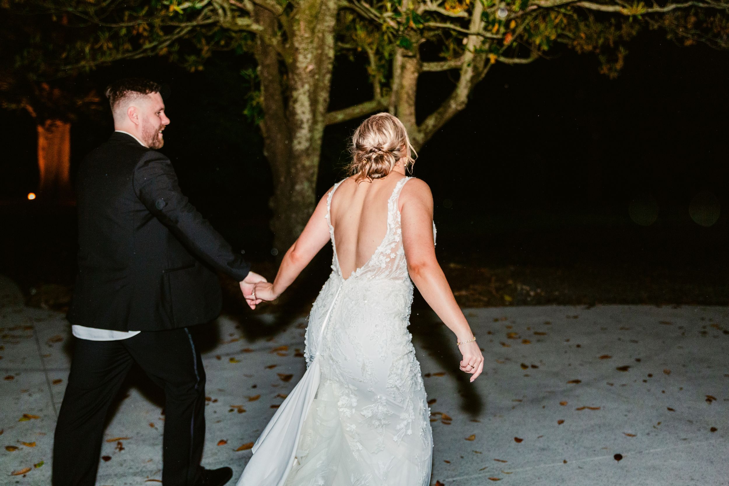 A sequence of black and white photos showing a couple dancing in a wooded outdoor setting.