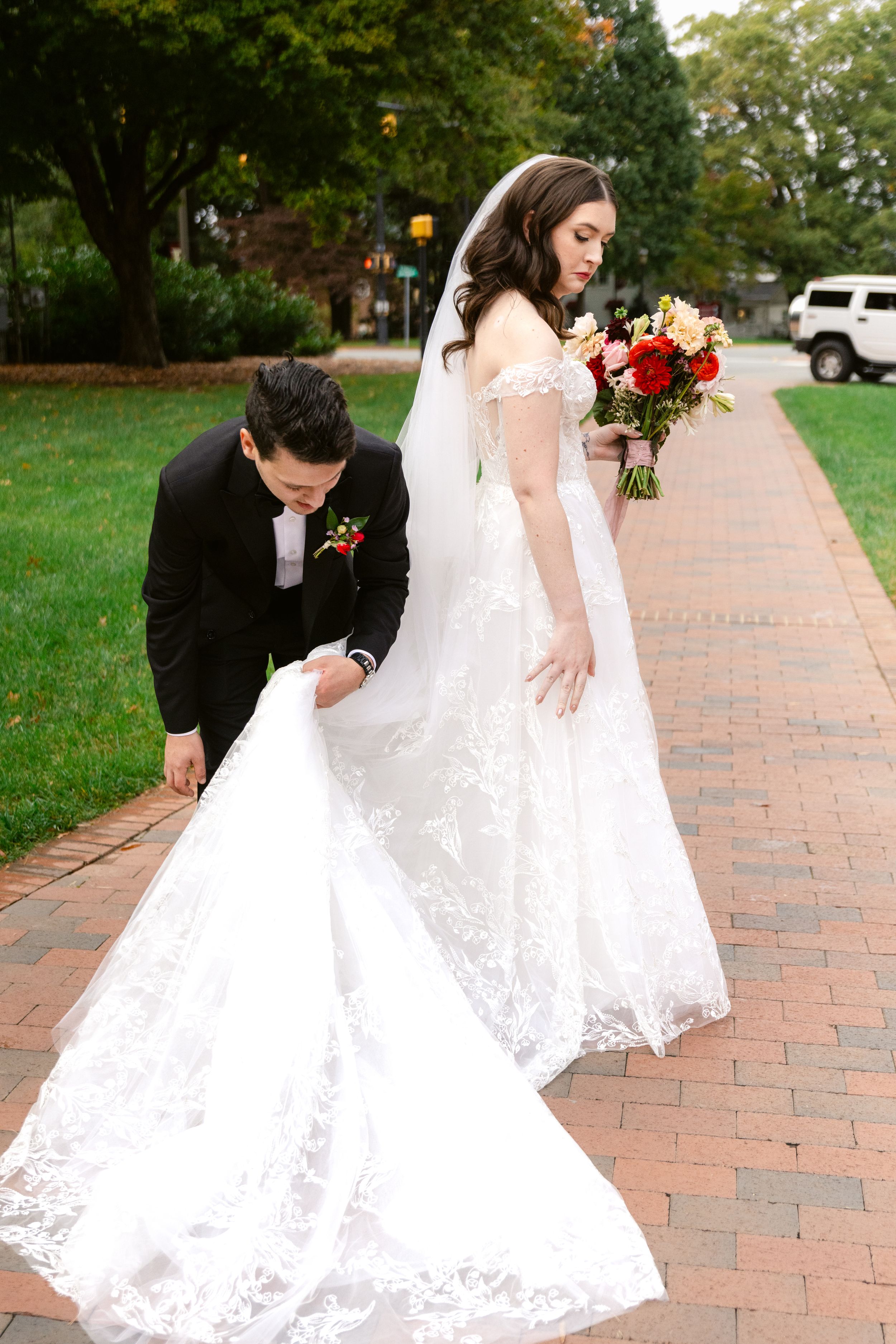 A romantic wedding photo sequence showing a couple in formal attire walking and posing on a brick pathway outdoors.
